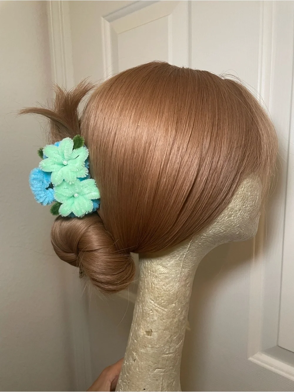 Handmade blue and green pipe cleaner floral hair clip